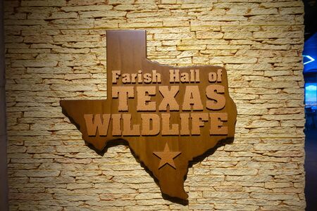 HOUSTON, USA - JANUARY 12, 2017:An informative sign with the map of texas in wood over a wall exposition inside of the National Museum of Natural Science in Orlando Houston in USAのeditorial素材