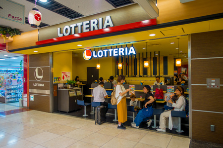 KYOTO, JAPAN - JULY 05, 2017: Unidentified people at lottery store playing, inside of Keihan Railway Station in Kyoto, Japan. Keihan Railway company was founded in 1949 and is among busiest in Japanのeditorial素材