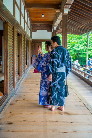 KYOTO, JAPAN - JULY 05, 2017: Unidentified couple taking pictures of the Hojo Hall of Tenryu-ji in the Arashiyama district of Kyotoのeditorial素材