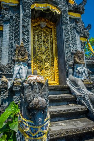 BALI, INDONESIA - MARCH 11, 2017: Inside of balinese temple a dragon sculpture with door of at Pura Uluwatu, Bali, Indonesiaのeditorial素材