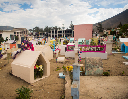 QUITO, ECUADOR- MAY 23, 2017: View of cemetery San Antonio de Pichincha, showing typical catholic graves with large gravestones, mountain backgroundのeditorial素材