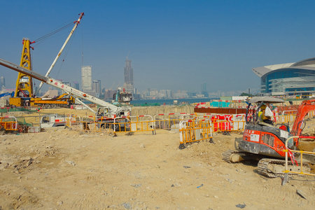 HONG KONG, CHINA - JANUARY 26, 2017:Construction site of pier, with different machines in a sunny...