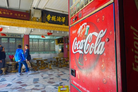 HONG KONG, CHINA - JANUARY 26, 2017: Unidentified people at indoor, near of a Soda machine inside of Tsz wan temple, in Hong Kong.のeditorial素材