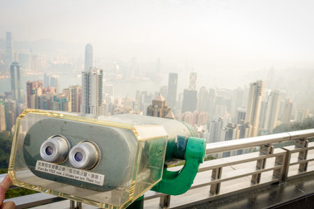 HONG KONG, CHINA - JANUARY 22, 2017: Close up of a view machine of victoria peak tower and tram in...