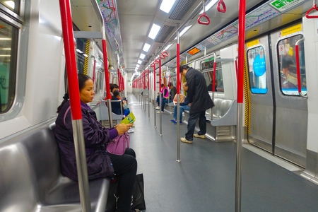 HONG KONG, CHINA - JANUARY 26, 2017: Unidentified people inside of metro, people lifestyle background inside the train.のeditorial素材