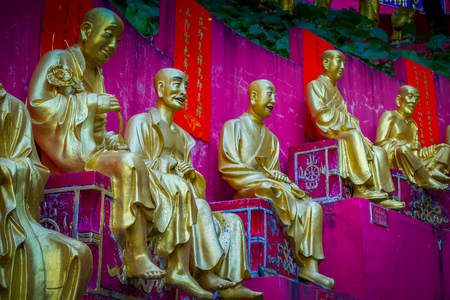 Spectacular golden statues at Ten Thousand Buddhas Monastery in Sha Tin, Hong Kong, China.の写真素材