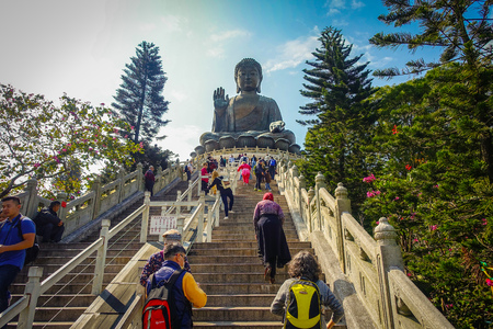 HONG KONG, CHINA - JANUARY 26, 2017: Unidentified people walking upstairs to see the Tian Tin monastery and the Big Buddha at the Po Lin Monastery, Lantau Island, Hong Kongのeditorial素材