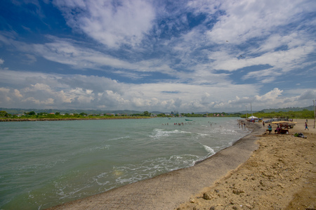 Beautiful view of the beach with sand, in a beautiful day in with sunny weather in a blue sky in Same, Ecuadorの写真素材