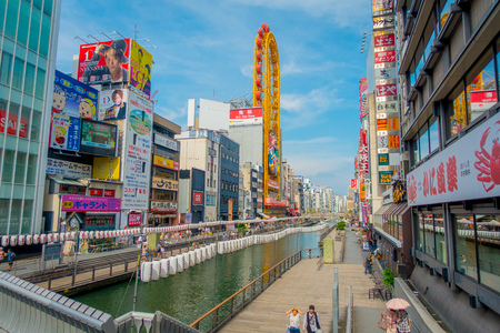 OSAKA, JAPAN - JULY 18, 2017: Glico billboard at Dotonbori shopping street in Osaka. The Landmark at Namba. The tourism must go there and take a photo with this banner.のeditorial素材