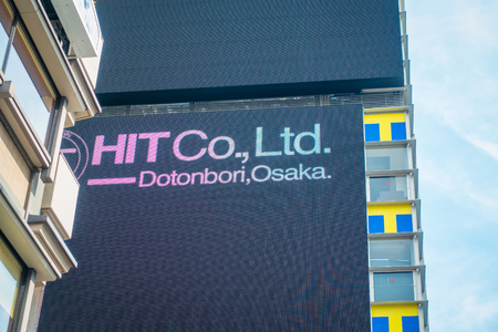 OSAKA, JAPAN - JULY 18, 2017: Glico billboard at Dotonbori shopping street in Osaka. The Landmark at Namba. The tourism must go there and take a photo with this banner.のeditorial素材