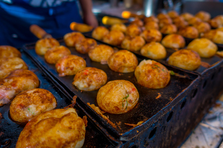 Close up of fried food located in a public market at Dotonbori district at Osaka Japan.の写真素材