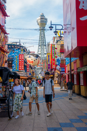 OSAKA, JAPAN - JULY 18, 2017: Tsutenkaku Tower is a tower and well-known landmark of Osaka. It is located in the Shinsekai district of Naniwa-ku, Osaka, Japan