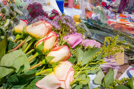 ORLANDO, USA - MAY 05, 2017: Flowers over a place where Omar Mateen, killed 49 people and wounded 53 others in a terrorist attack hate crime in a gay nightclub in Orlando, Florida, United Statesのeditorial素材