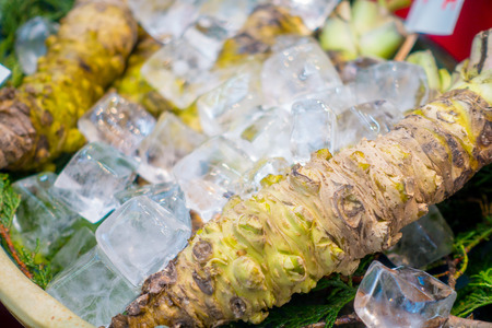 OSAKA, JAPAN - JULY 18, 2017: Fresh wasabi root are sold along the street at Kuromon Ichiba market, Nipponbashi, Osaka, Japanのeditorial素材
