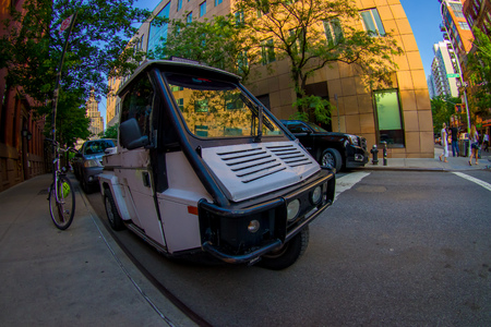 NEW YORK, USA - JUNE 22, 2017: Gorgeous cars parked in the beautiful city of New York, surrounding of skyscrapers and gorgeous buildings in New York City, fish eye effectのeditorial素材