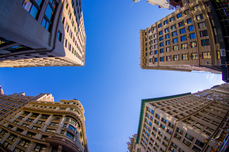 NEW YORK, USA - JUNE 22, 2017: Beautiful view of the city in New York with skyscrapers and gorgeous buildings, in a sunny day with a beautiful blue sky, below view in New York City, fish eye effectのeditorial素材