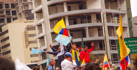 Quito, Ecuador - April 7, 2016: Crowd of unidentified people with ecuadorian and white flags supporting the presidential candidate Guillermo Lasso, and journalists during anti government protests in Shyris Avenueのeditorial素材