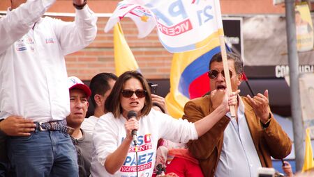 Quito, Ecuador - April 7, 2016: Unidentified people with ecuadorian and white flags talking in microphone and supporting the presidential candidate Guillermo Lasso, and journalists during anti government protests in Shyris Avenueのeditorial素材