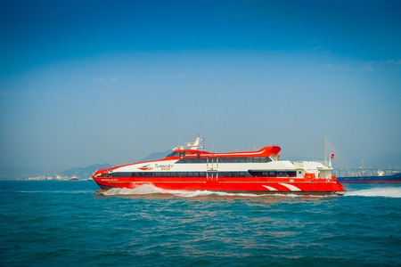 HONG KONG, CHINA - JANUARY 26, 2017: Luxury boat with a beautiful view of Hong Kong in the horizont, with a skyscrapers and modern buildingsのeditorial素材