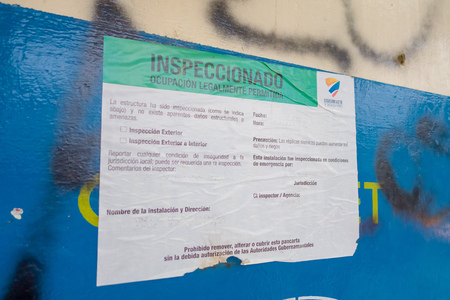 MANTA, ECUADOR- MAY 11, 2017: Informative sign about building structures, green is for occupation legally permitted of the building after earthquake by the April 16Th, 2016 during the Earthquake Measuring 7.8 on the Richter Scale, South America, Manta Ecuのeditorial素材