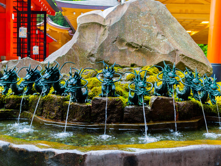 HAKONE, JAPAN - JULY 02, 2017: Close up of a fountain with a bronze dragon in Japan.のeditorial素材