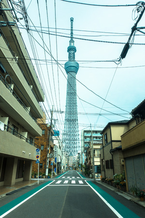 TOKYO, JAPAN -28 JUN 2017: The Tokyo Skytree is a new television broadcasting tower and landmark of Tokyo. It is the centerpiece of the Tokyo Skytree Town in the Sumida City Ward, view from dowtown in the city of Tokyoのeditorial素材