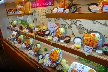 TOKYO, JAPAN -28 JUN 2017: Close up of assorted plastic japanesse food over a showcase in Tokyoのeditorial素材
