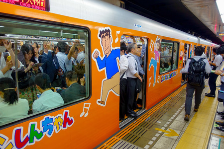 TOKYO, JAPAN - CIRCA MAY 2014: Crowd of people hurry at Ikebukuro station in Tokyo, Japan. Ikebukuru is the second-busiest railway station in the worldのeditorial素材