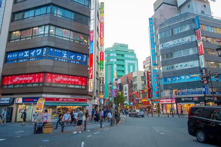 TOKYO, JAPAN JUNE 28 - 2017: Unidentifies people crossing the street using the crosswalk at Ikebukuro district of Tokyo metropolis, Japan. Tokyo Metropolis is both the capital and most populous city of Japanのeditorial素材