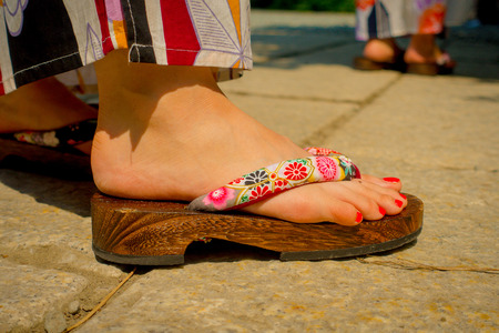 TOKYO, JAPAN JUNE 28 - 2017: Close up of a feet of woman wearing a wooden sandals in Kamakura,Tokyo Japanのeditorial素材