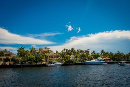 FORT LAUDERDALE, USA - JULY 11, 2017: Beautiful view of new river with riverwalk promenade highrise condominium buildings and yachts parked in the river, in Fort Lauderdale, Florida.のeditorial素材