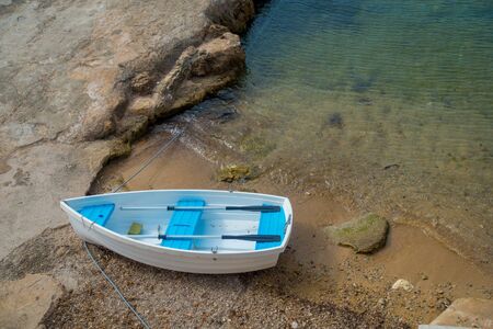 Aerial view of a boat in the water in Andratx port marina in Mallorca balearic islandsの写真素材