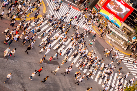 TOKYO, JAPAN JUNE 28 - 2017: Top view of crowd of people crossing in Shibuya street, one of the busiest crosswalks in the world, in the Ginza District in Tokyoのeditorial素材