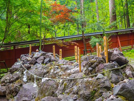 Tokyo, Japan - August 24, 2017: Close up of a japaness letters in a stick over a rocks, at Gion Matsuri is Japans most popular festival, held annually in Kyotoのeditorial素材