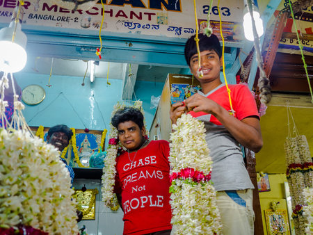 BANGALORE, INDIA - June 06 2017: Unidentified guys as flower sellers at KR Market in Bangalore. in Bangalore, Indiaのeditorial素材