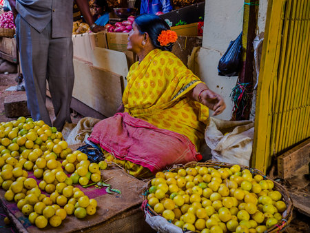 JAIPUR, INDIA - AUGUST 25: Indian women sells food in the streets in Jaipur, India. In India poor...