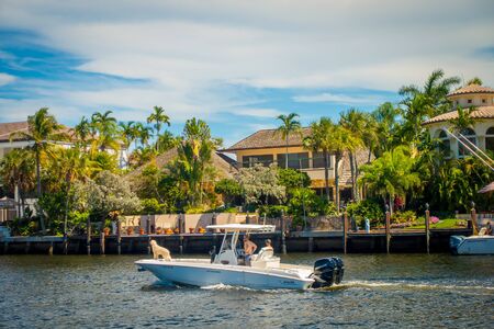 FORT LAUDERDALE, USA - JULY 11, 2017: Unidentified people at yachts enjoying the beautiful view of new river with riverwalk promenade with condominium buildings and in Fort Lauderdale, Floridaのeditorial素材
