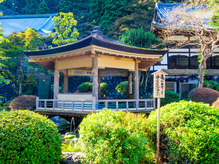 Nara, Japan - July 26, 2017: Unidentified people sitting inside of a building in the garden, enjoying the pond at Todai Ji Templeのeditorial素材