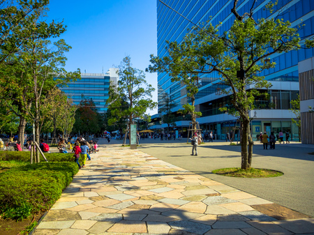 TOKYO, JAPAN JUNE 28 - 2017: Unidentified people walking near of a public park in Tokyoのeditorial素材
