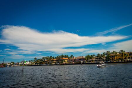 FORT LAUDERDALE, USA - JULY 11, 2017: Unidentified people at yachts enjoying the beautiful view of new river with riverwalk promenade highrise condominium buildings and in Fort Lauderdale, Floridaのeditorial素材