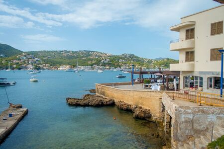 PORT D ANDRATX, SPAIN - AUGUST 18 2017: Andratx port marina in Mallorca balearic islands, with yatchs in the water and some buildings in the horizont, Spainのeditorial素材