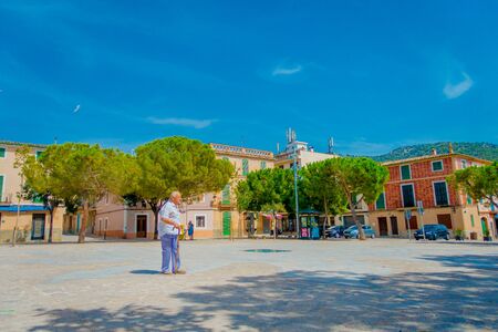 PORT D ANDRATX, SPAIN - AUGUST 18 2017: Unidentified old man walking in a park in Port d Andratrx, Spainのeditorial素材