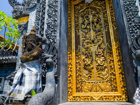 BALI, INDONESIA - MARCH 11, 2017: Golden door of the Uluwatu temple in Bali island, Indonesiaのeditorial素材
