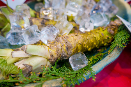 OSAKA, JAPAN - JULY 18, 2017: Fresh wasabi root are sold along the street at Kuromon Ichiba market, Nipponbashi, Osaka, Japanのeditorial素材