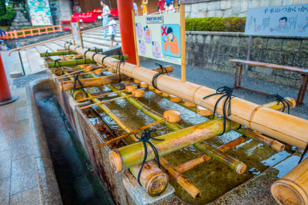 KYOTO, JAPAN - JULY 05, 2017: Close up of hand wash pavilion in Fushimi Inari Shrine in Kyoto