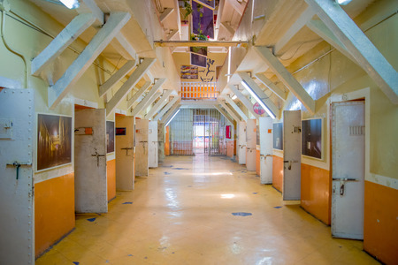 QUITO, ECUADOR - NOVEMBER 23, 2016: Indoor view of old deserted rugged building, cells of prisoners in the old prison Penal Garcia Moreno in the city of Quitoのeditorial素材