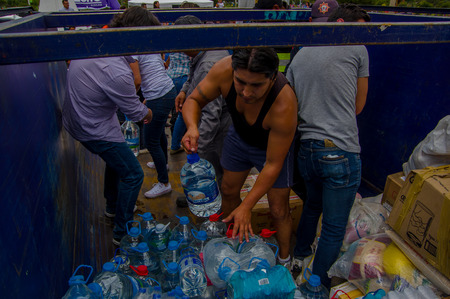 Quito, Ecuador - April,17, 2016: Crowd of people of Quito providing disaster relief food, clothes, medicine and water for earthquake survivors in the coast, located in the Carolina parkのeditorial素材