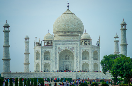 Agra, India - September 20, 2017: Crowd of people enjoying the beautiful view of the Taj Mahal, in a gorgeous blue sky, with an ivory-white marble mausoleum on the south bank of the Yamuna riverin the city of Agra, in India.のeditorial素材