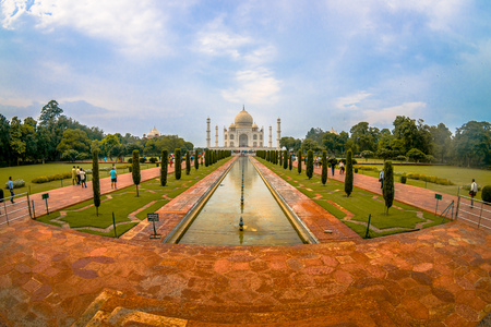 Agra, India - September 20, 2017: Unidentified people walking and taking pictures of the beautiful Taj Mahal, is an ivory-white marble mausoleum on the south bank of the Yamuna river in the Indian city of Agra, Uttar Pradesh, fish eye effect.のeditorial素材