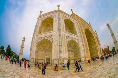 Agra, India - September 20, 2017: Unidentified people walking near of the Taj Mahal building structure, is an ivory-white marble mausoleum on the south bank of the Yamuna river in the Indian city of Agra, Uttar Pradesh, fish eye effect.のeditorial素材